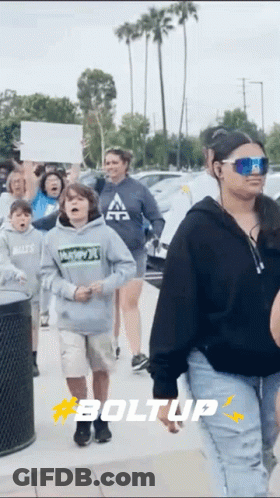 Group Walking Down Street With Boltup GIF