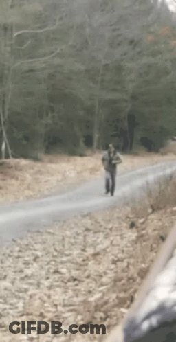 Group Walking On Red Track One Jumping GIF