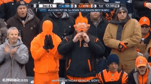 Group Watching Football With Orange Hair Man GIF