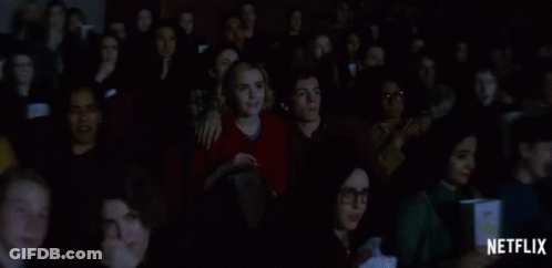 Group Watching Movie With Netflix Logo On Bottom GIF