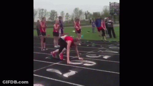 Group Watching Runner On Track GIF