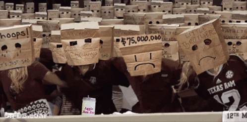 Group Wearing Paper Bags On Heads With Hoops GIF
