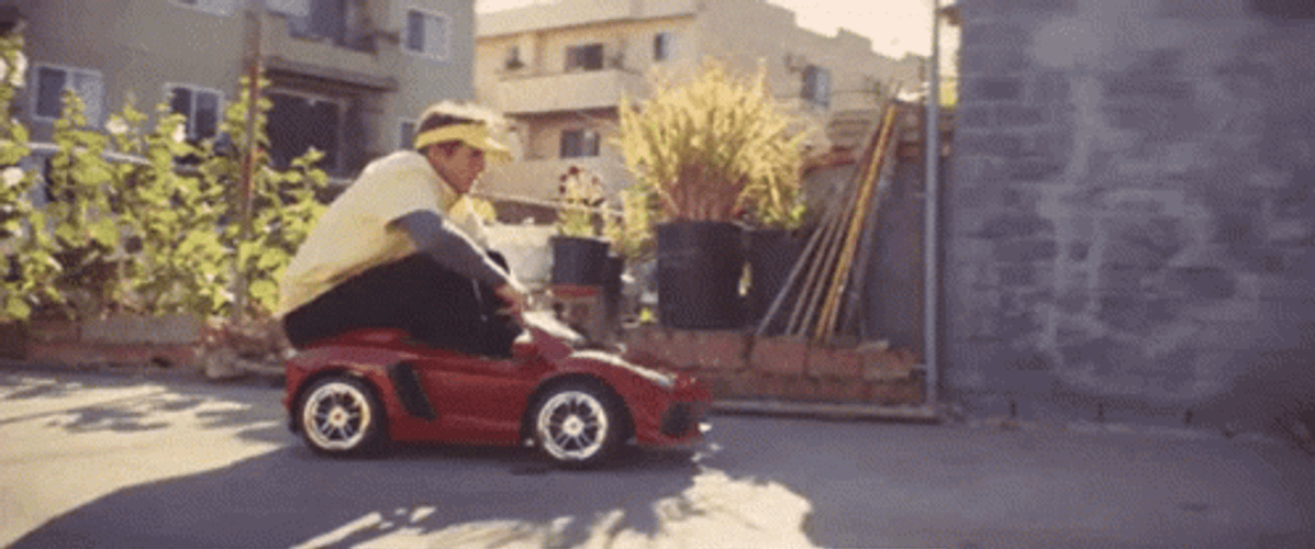 Grown Guy Riding Toy Car GIF
