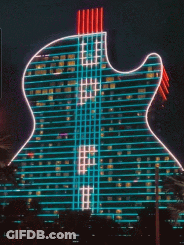 Guitar-Shaped Building Lit With Neon Lights GIF