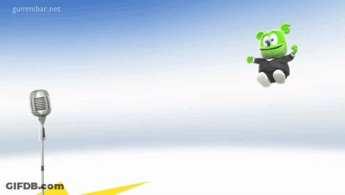 Gummy Bear In Tuxedo Jumping In Front Of Microphone GIF