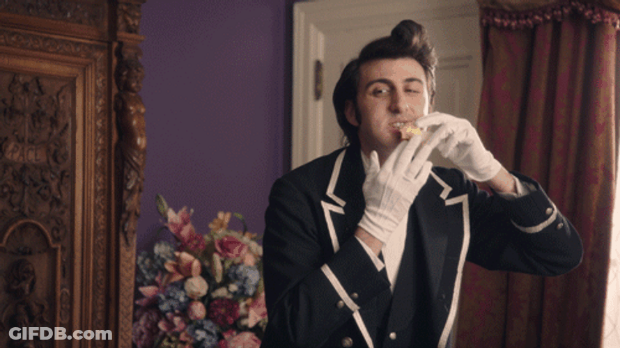 Guy Butler Eating Hands With Gloves GIF