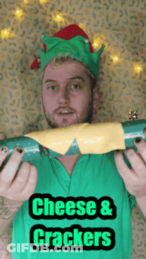 Guy Christmas Elf Cheese And Crackers GIF