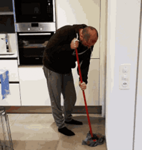 Guy Cleaning The Floor With A Mop GIF