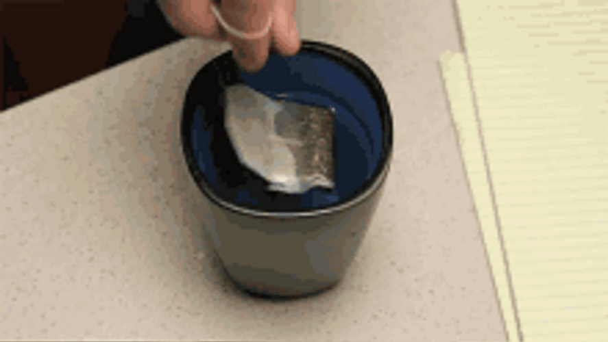 Guy Dipping Tea Bag And Drinking GIF