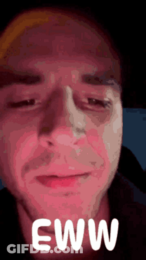Guy Facing His Phone Eww Facial Expression GIF