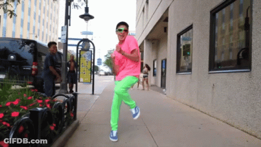 Guy In Colorful Outfit Walking Funnily GIF