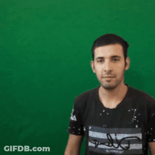 Guy In Front Of Green Wall GIF