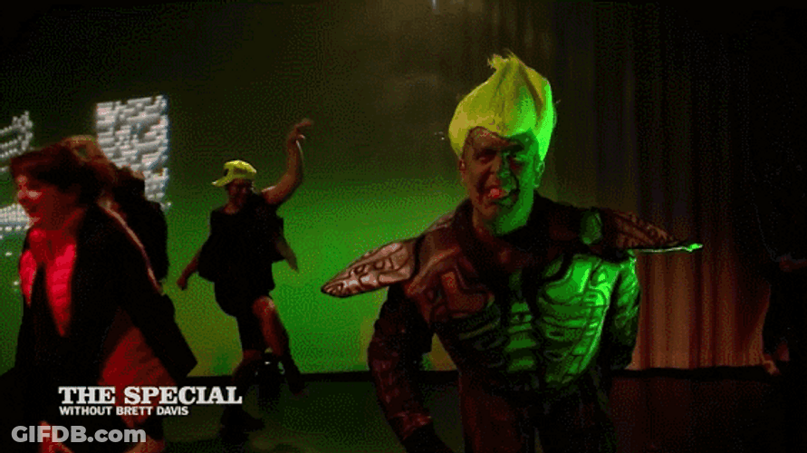 Guy In Green Goblin Shark Costume Sing GIF