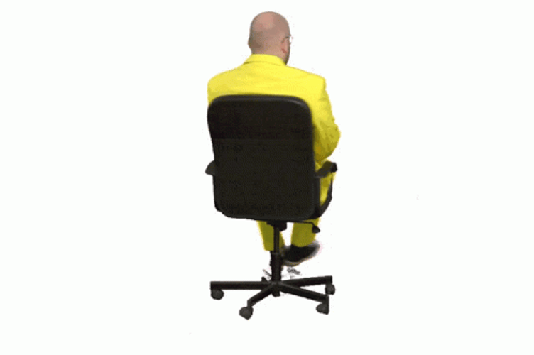 Guy In Yellow Suit Spins Chair GIF
