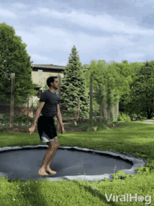 Guy Jumping On A Trampoline GIF