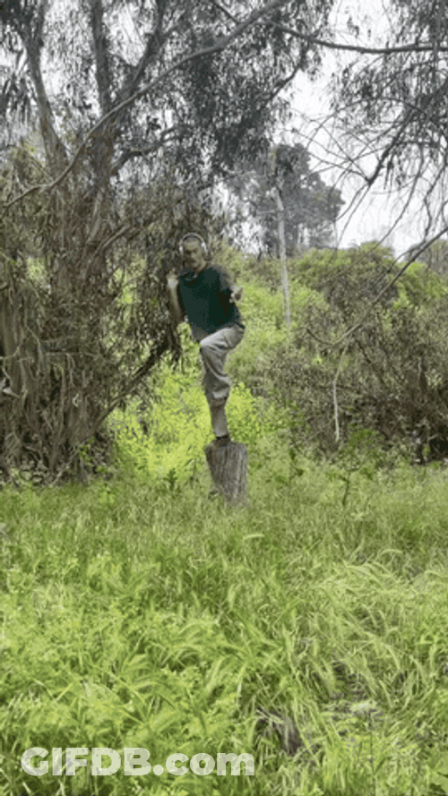 Guy Listening To Music Dancing Outside GIF