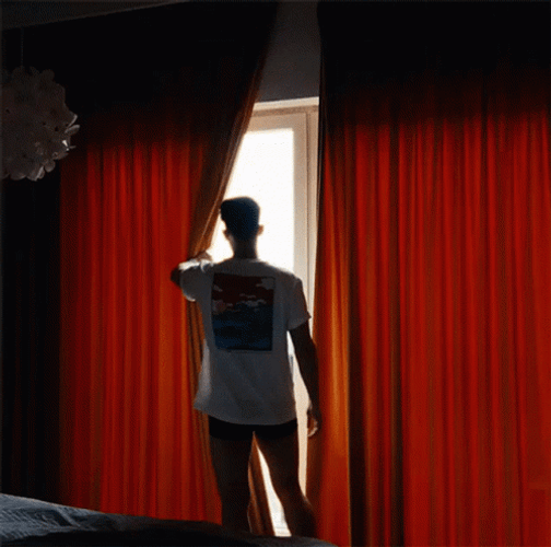 Guy Opening Window Curtain GIF