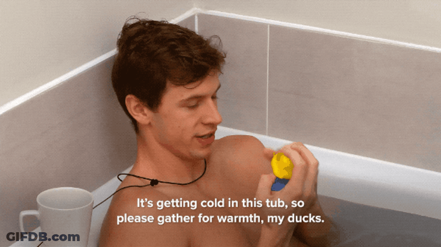 Guy Plays Rubber Duckies Bath Time GIF