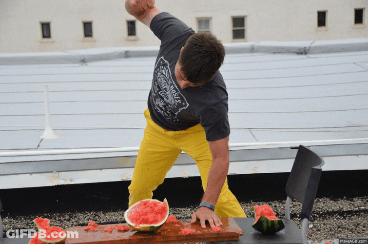 Guy Punch The Watermelon GIF