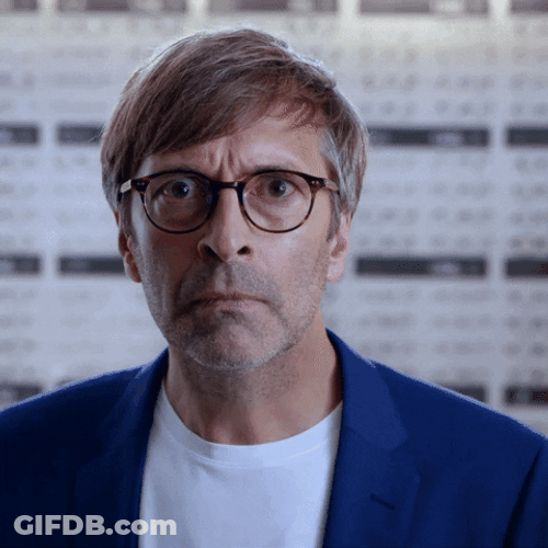 Guy Removing Eyeglasses And Looking GIF