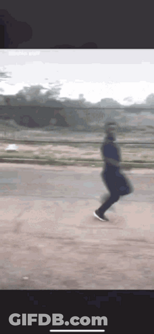 Guy Running Away Giving Dirty Finger GIF