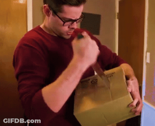 Guy Stabbing A Small Box GIF