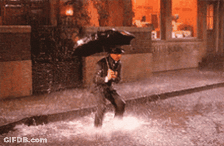Guy Tapping His Feet Dancing In The Rain GIF