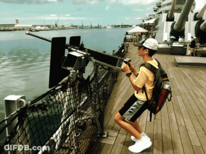 Guy Trying To Use Weapons On The Battleship GIF