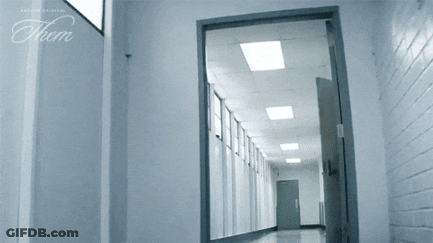 Guy Walking Fast In Hall Holding Files GIF