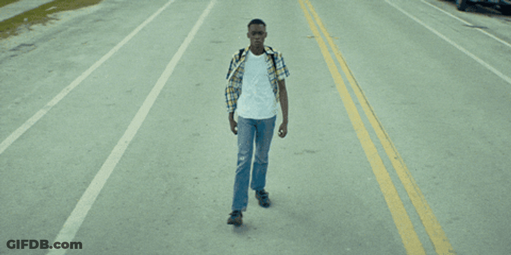 Guy Walking In The Middle Of Road GIF