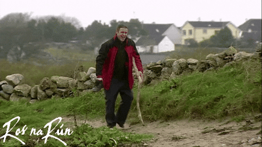 Guy Walking With Long Stick For Support GIF