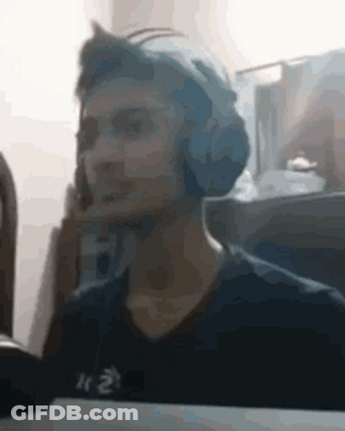 Guy With Headphones Suddenly Punching GIF