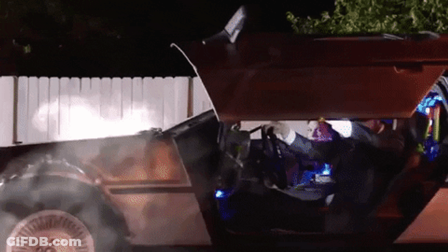 Guys Pushing Delorean On The Road GIF