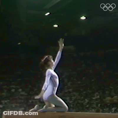 Gymnast Doing Trick On Balance Beam GIF