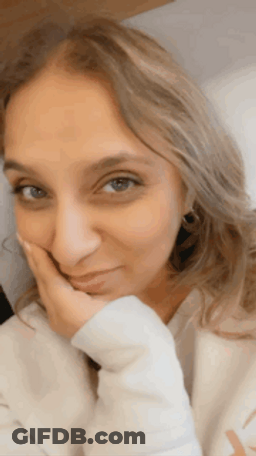 Hair Tuck Woman Wearing White Long Sleeve Top GIF