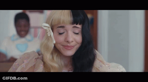Half Black Half Blonde Woman Smiling Eyes Closed GIF
