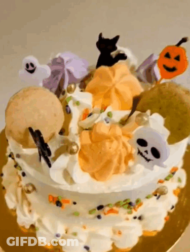 Halloween Cake With Ghosts Skulls And Pumpkins GIF
