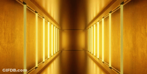 Hallway With Yellow Lights On Walls And Ceiling GIF