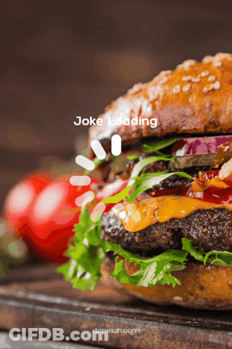 Hamburger Being Assembled With Cheese Tomato And Lettuce GIF