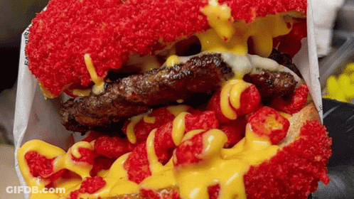 Hamburger Covered In Red And Yellow Toppings GIF