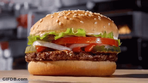 Hamburger With Lettuce Tomato Onions Cheese On Bun GIF