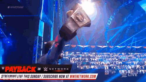 Hammer Held Up At Wrestling Event GIF