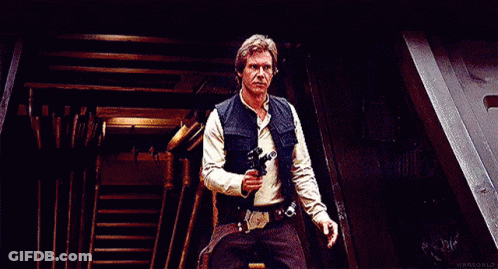 Han Solo From Star Wars Is Holding A Gun In His Hand And Making A Funny Face . GIF