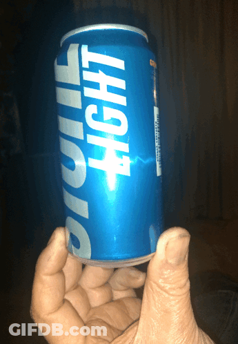 Hand Holding Blue Light Can GIF