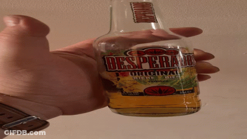Hand Holding Bottle Of Desperado Original Beer GIF