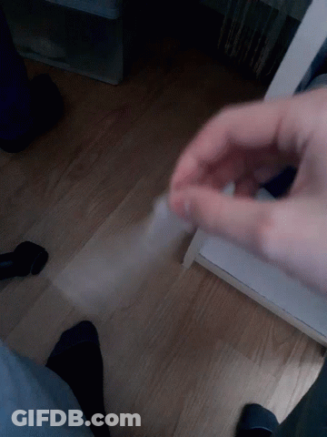 Hand Holding Clear Plastic GIF