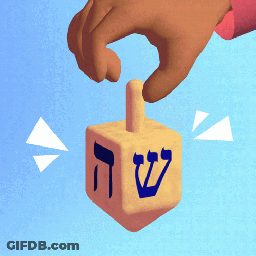 Hand Holding Dreidel With Hebrew Letter S GIF
