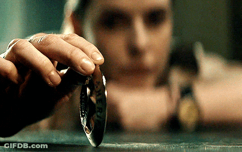 Hand Holding Liberty Coin GIF