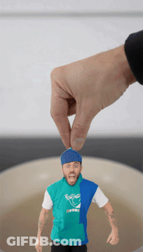 Hand Holding Man With Rockets Shirt GIF