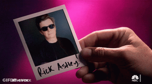 Hand Holding Polaroid Of Rick Ashley GIF